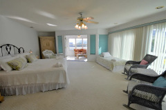 Caribbean Retreat Master Bedroom With King Bed And Childs Single Bed With Balcony As Well As Sunroom Access
